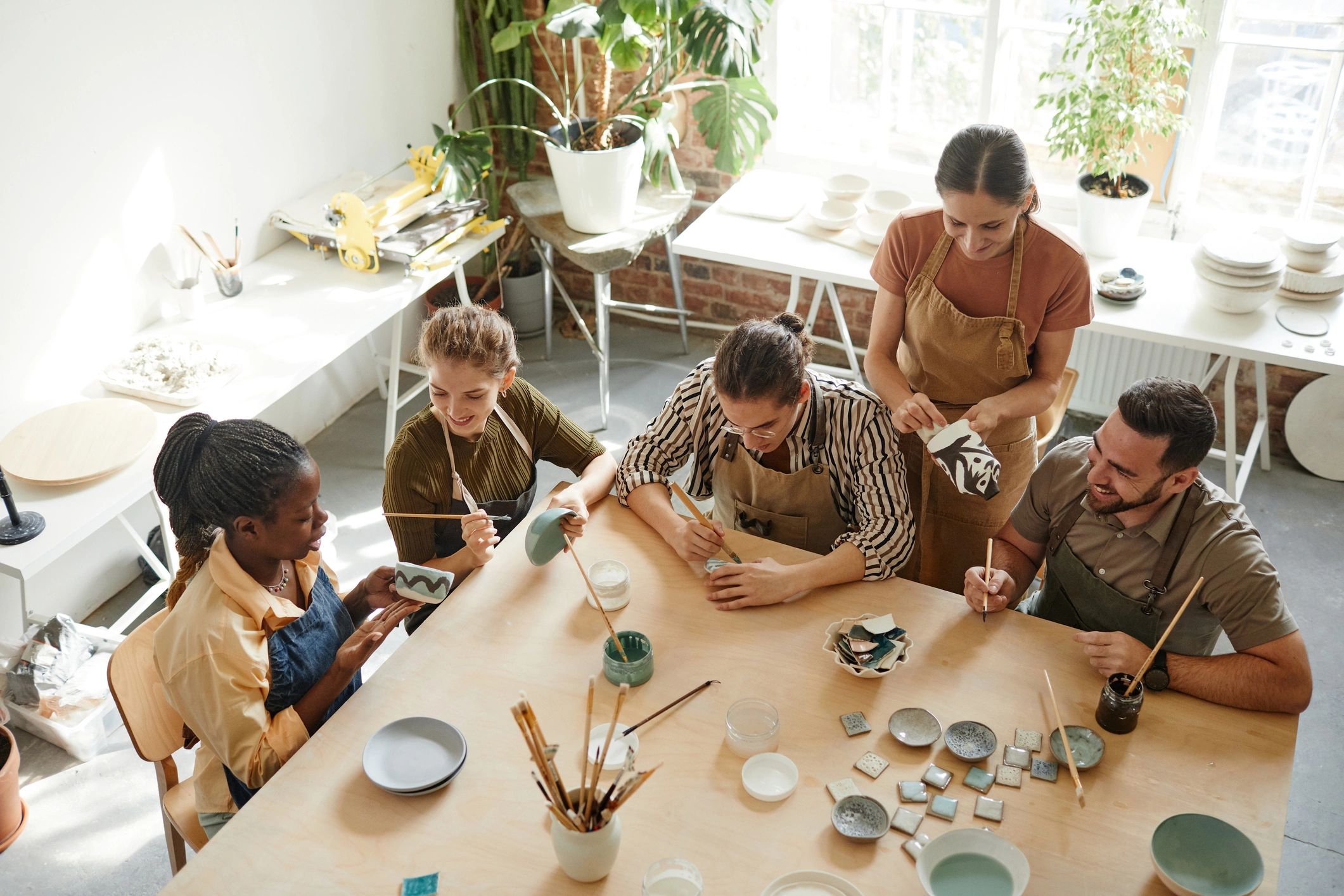 Creative arts workshop participants working together