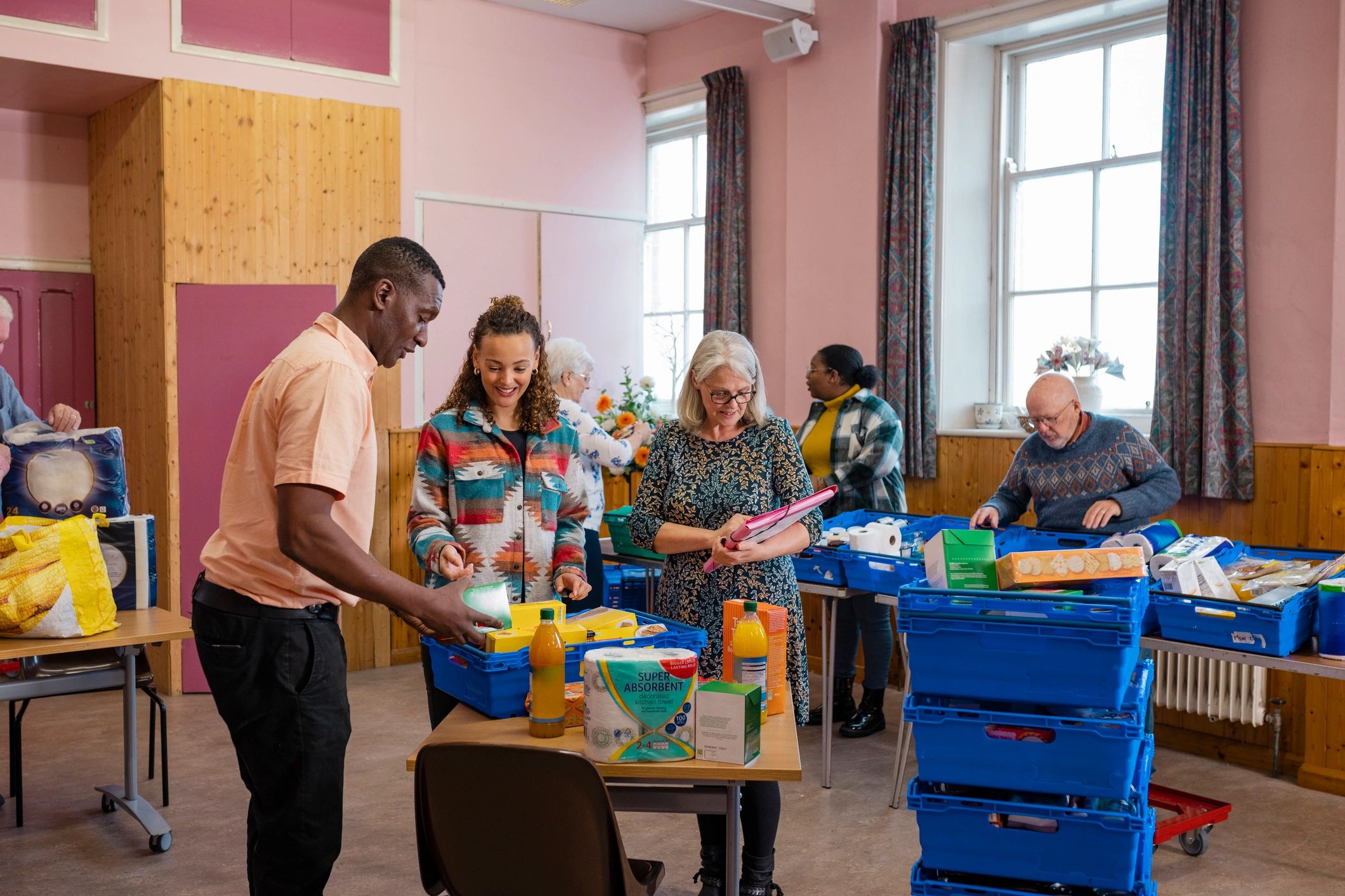 Community volunteers serving together at a church outreach event