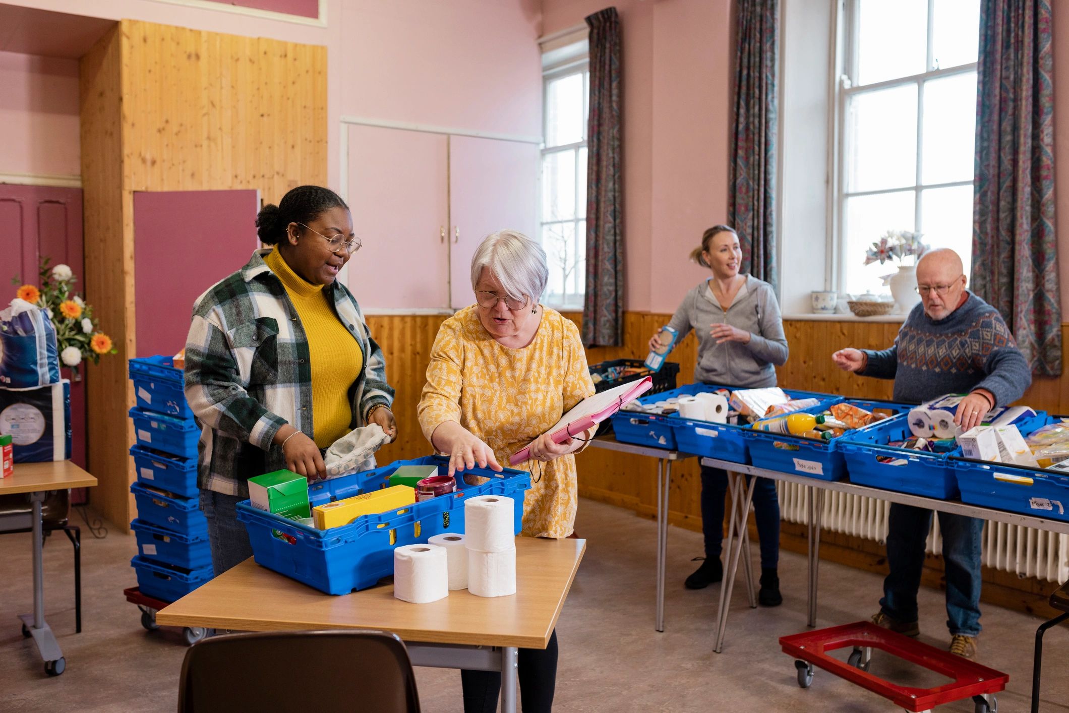 Volunteers organizing supplies during a community outreach project