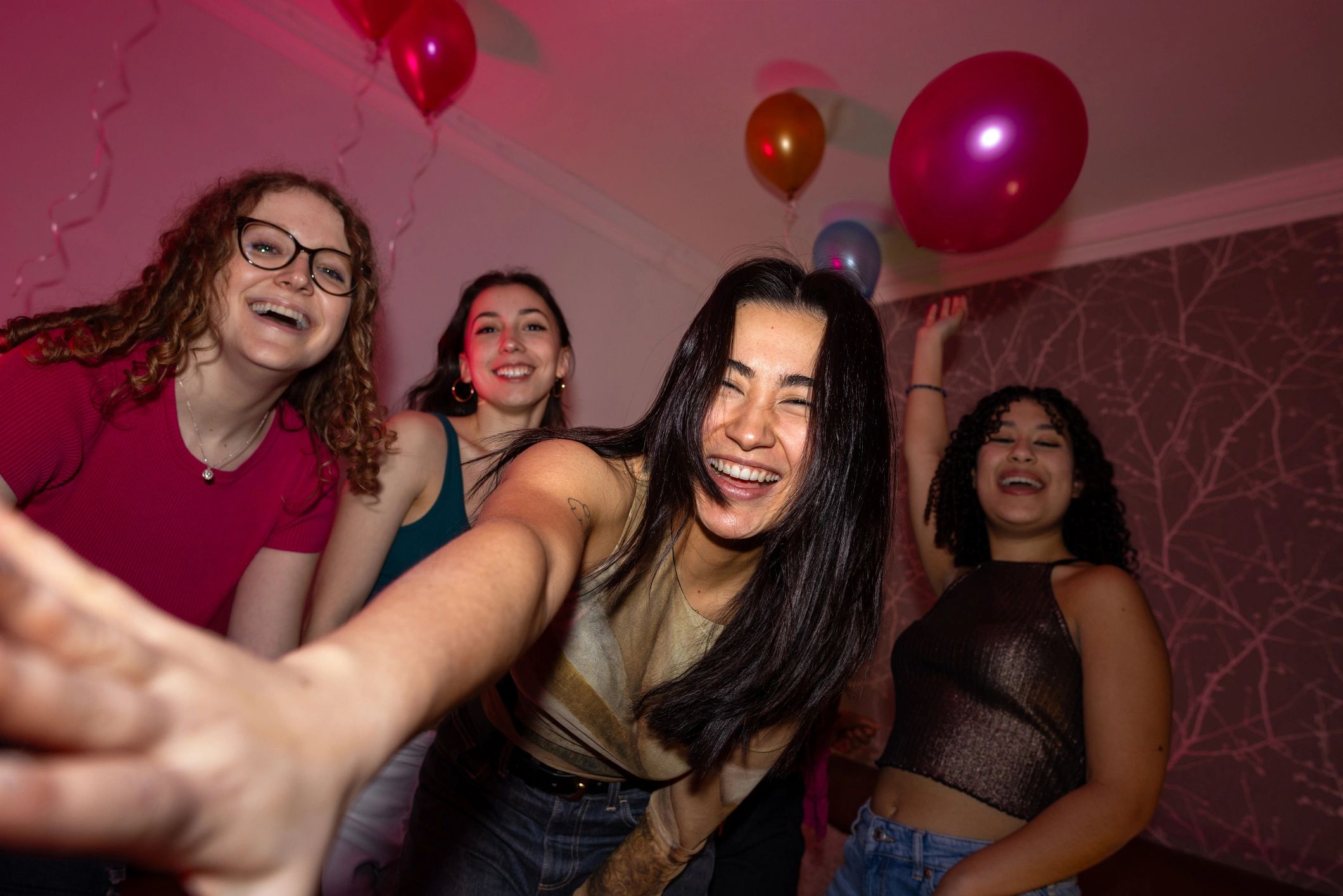 Young adults dancing together indoors