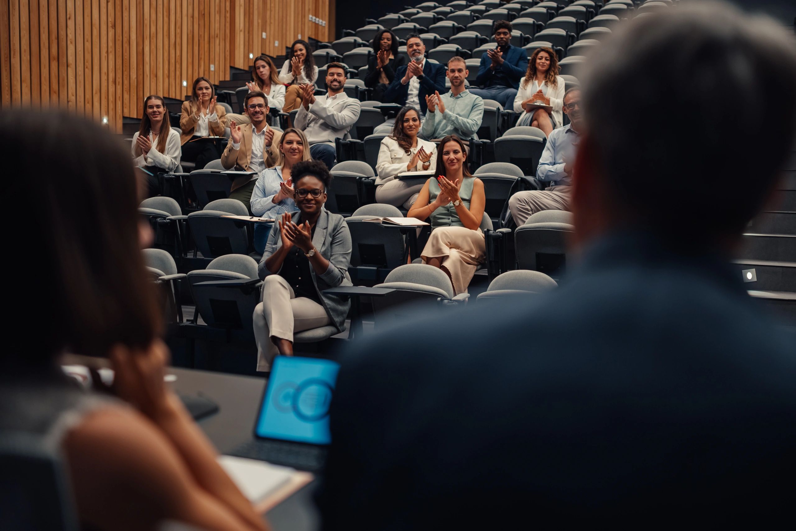 Conference audience applauding