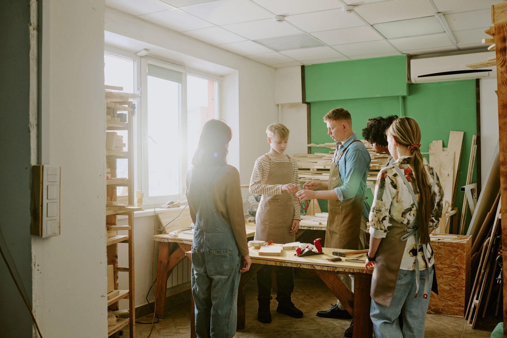 Young people learning together in a creative workshop