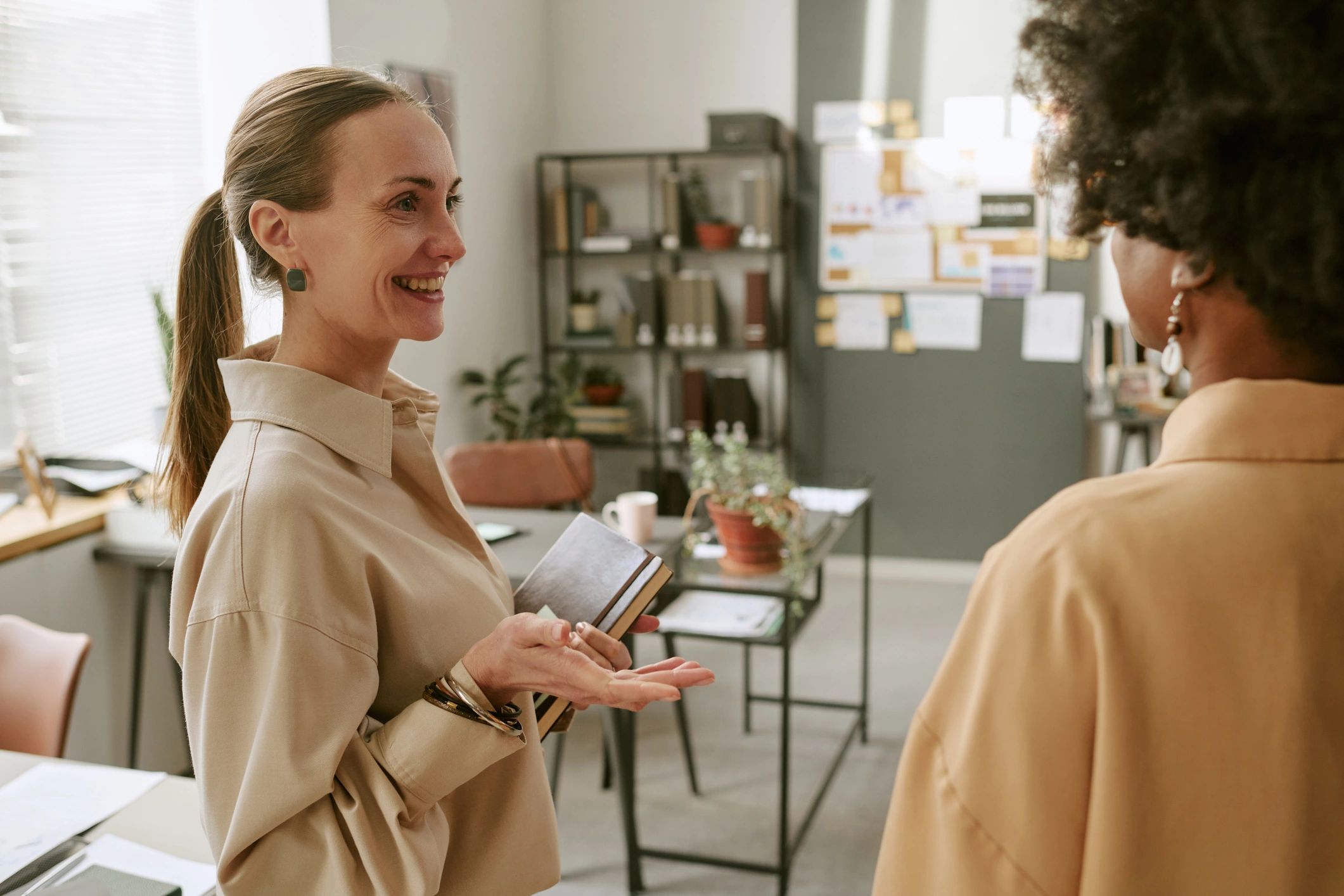 Two women in conversation representing mentoring and guidance